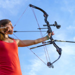 man pointing bow and arrow