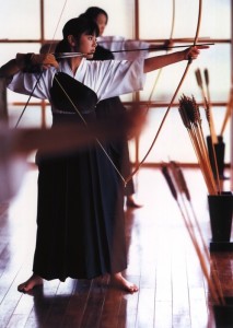 asian woman aiming bow